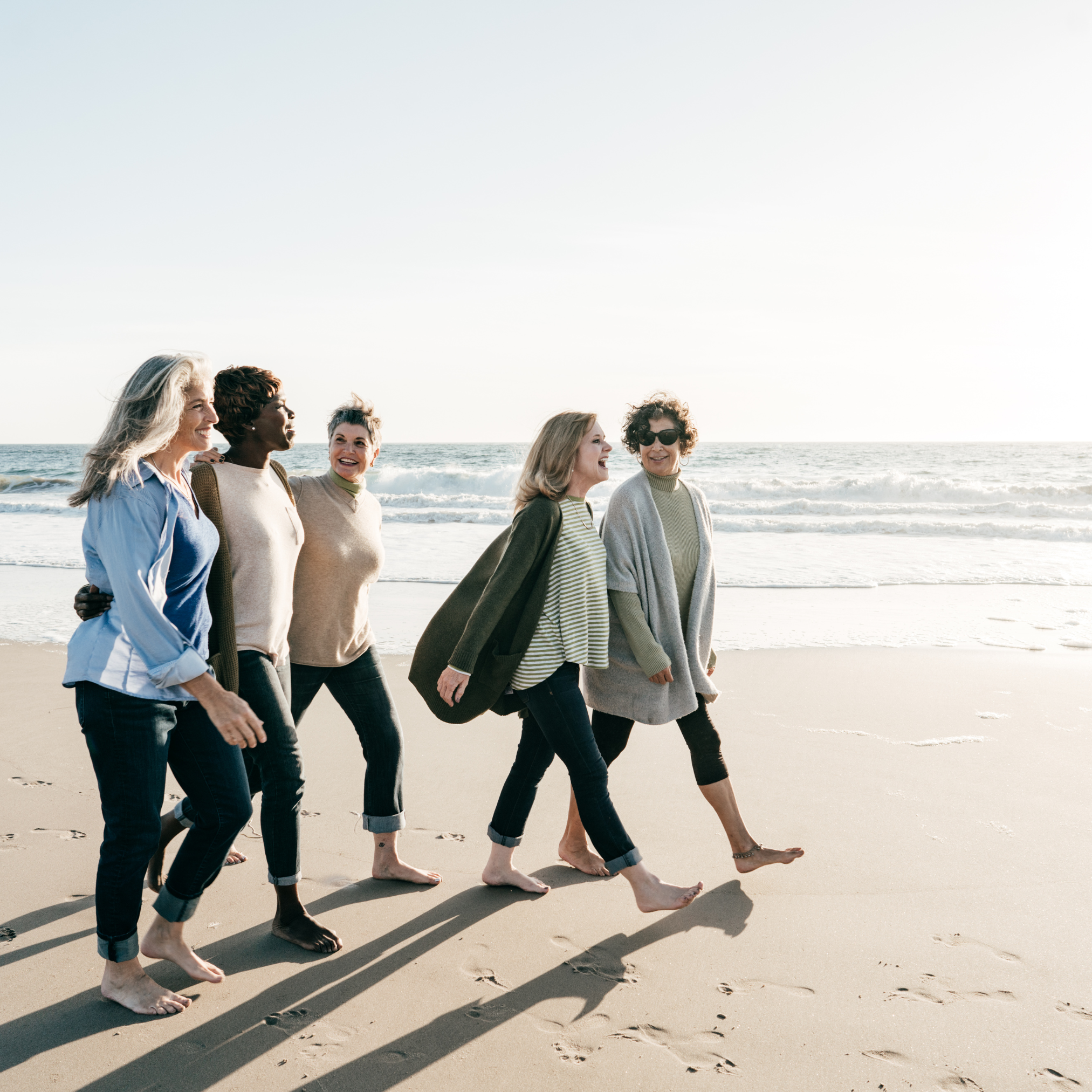 women walking on beach